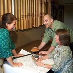 A customer reviewing curated custom stair and rail style options